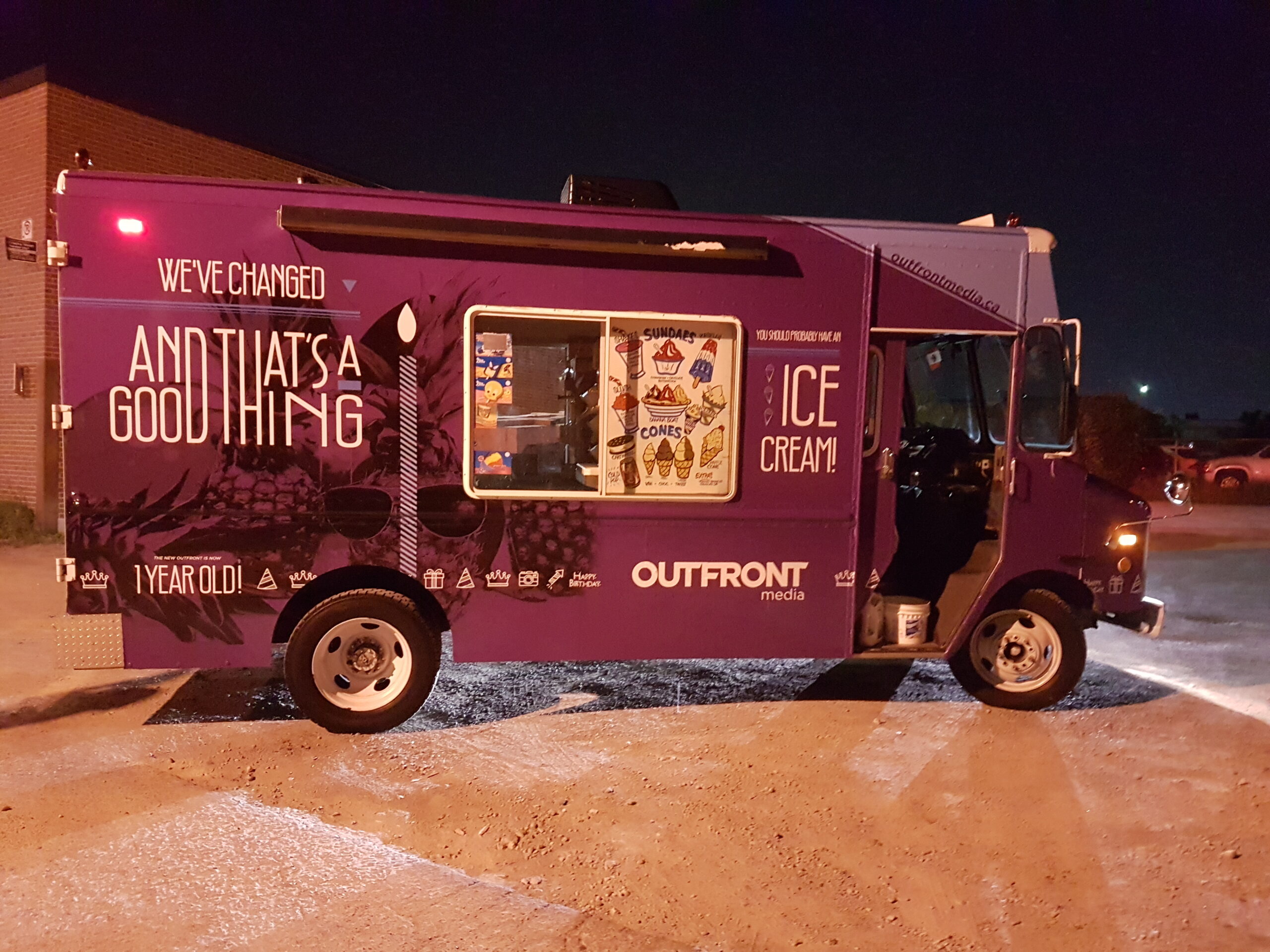 Purple Outfront Media ice cream truck with custom wrap and menu graphics
