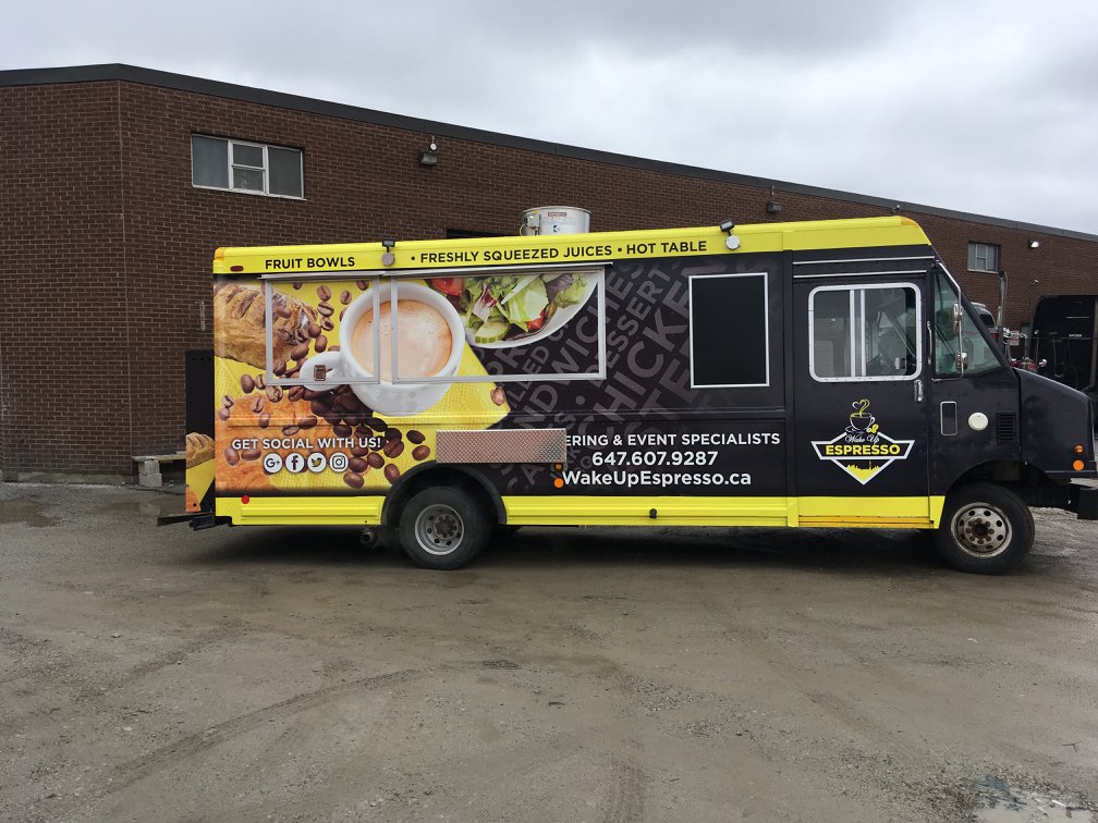 Espresso coffee truck with black and yellow custom graphics